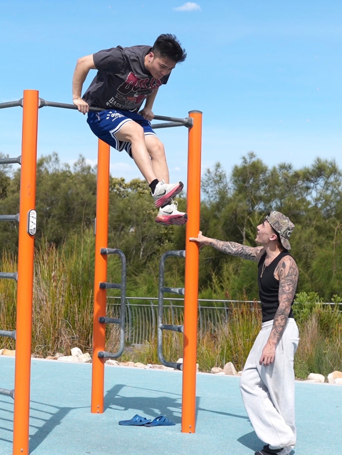 Athletes training at an outdoor calisthenics park